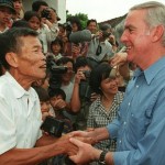 Pete Peterson shaking hands with Nguyen Viet Chop, one of Peterson's captors.