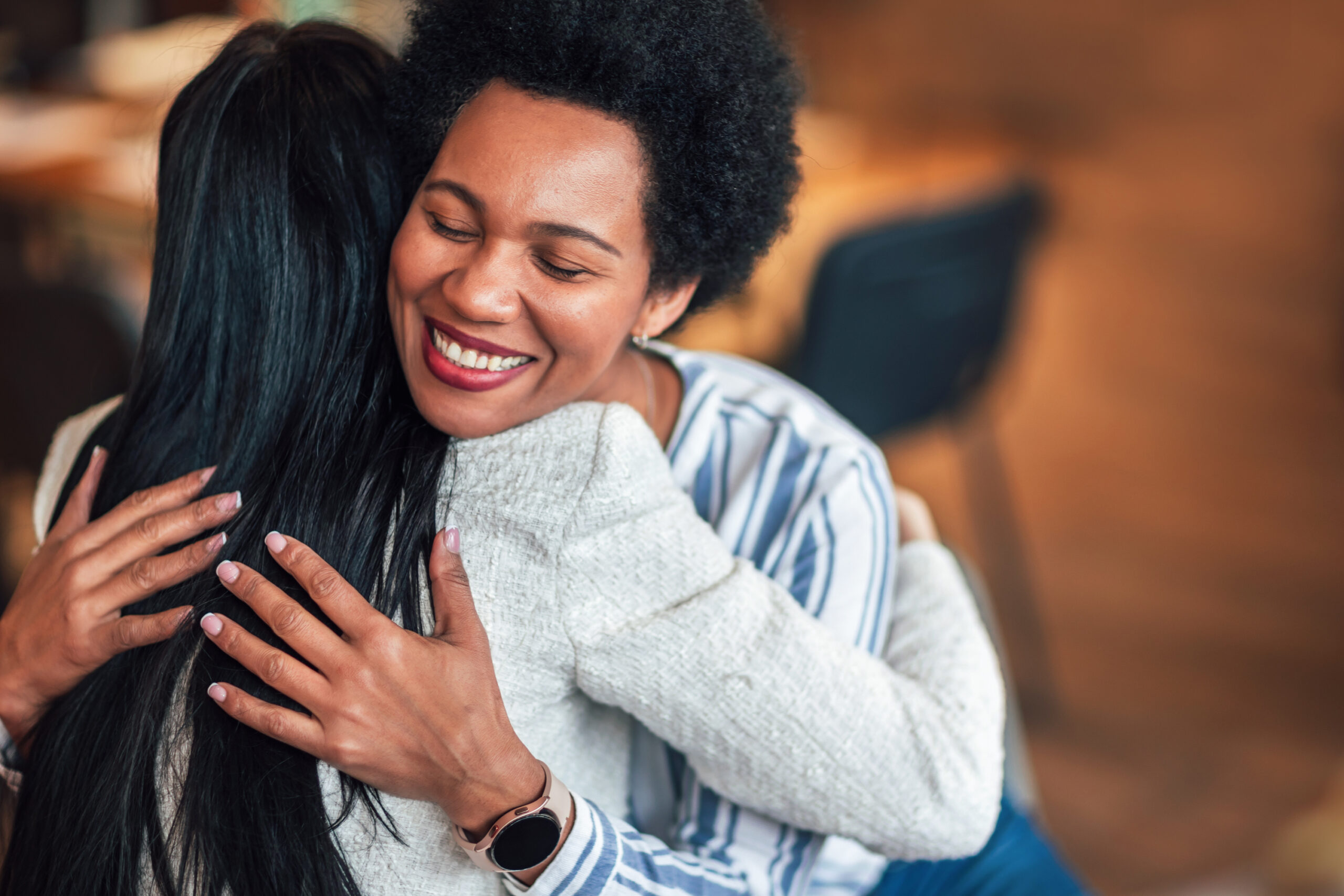 Support group patients hug each other during the therapy session Support group patients hug each other during the therapy session